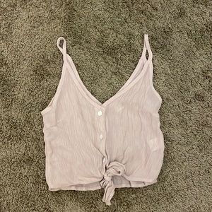 Cropped tank top with tie front.  Slightly see through and very light weight.
